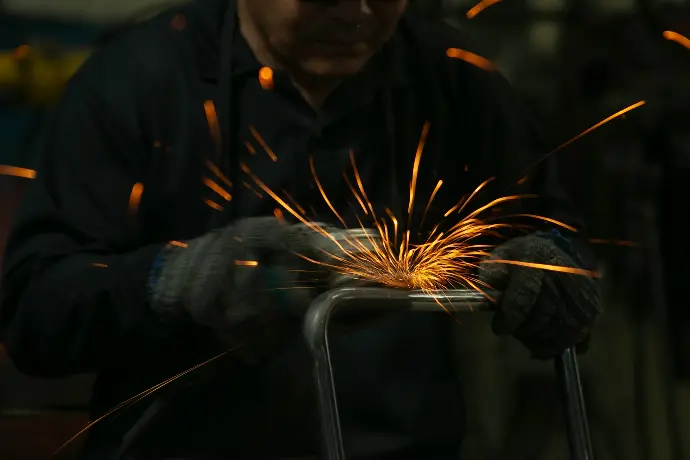 a man working on a piece of metal